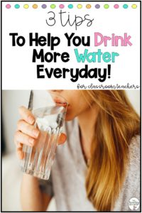 A woman drinking a glass of water