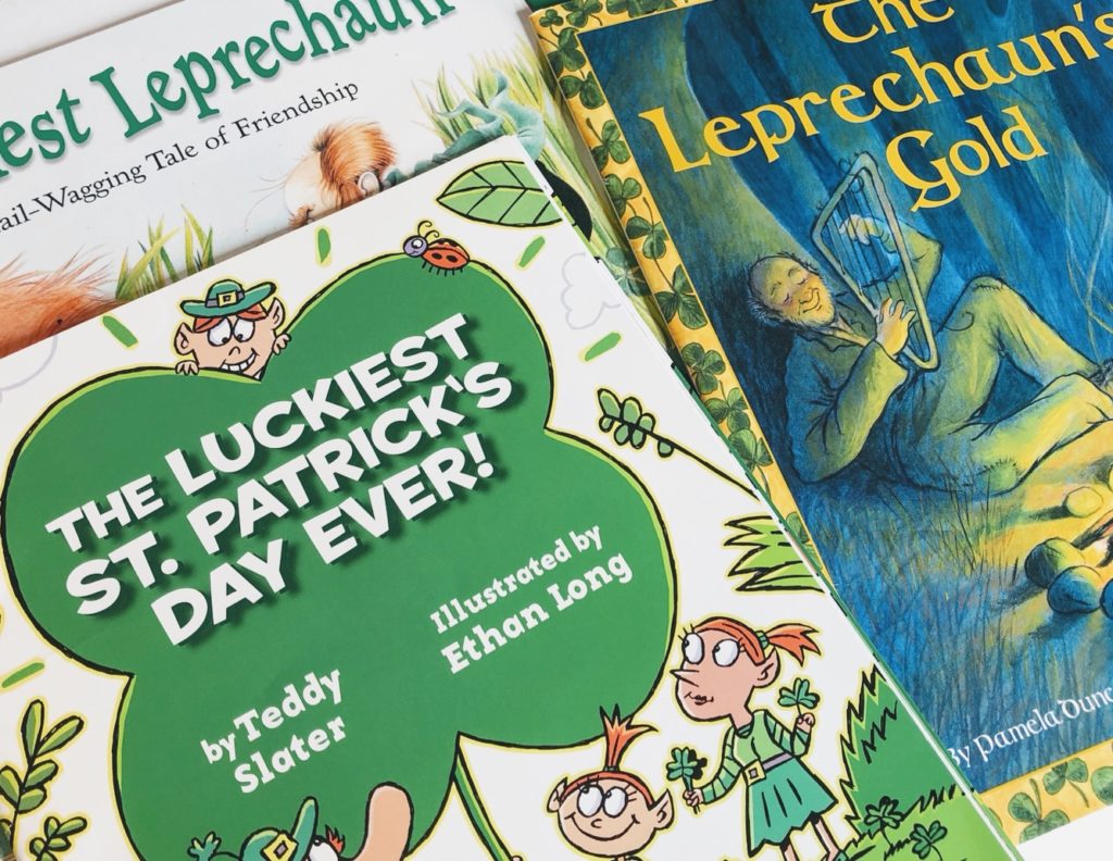  St. Patrick's Day books called, The Luckiest Leprechaun, The Luckiest St. Patrick's Day Ever, and The Leprechaun's Gold.  A dog staring at a leprechaun and a man playing a harp.